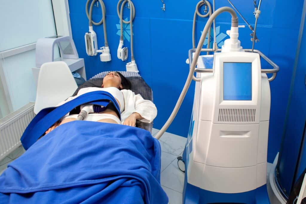 A woman getting coolsculpting treatment