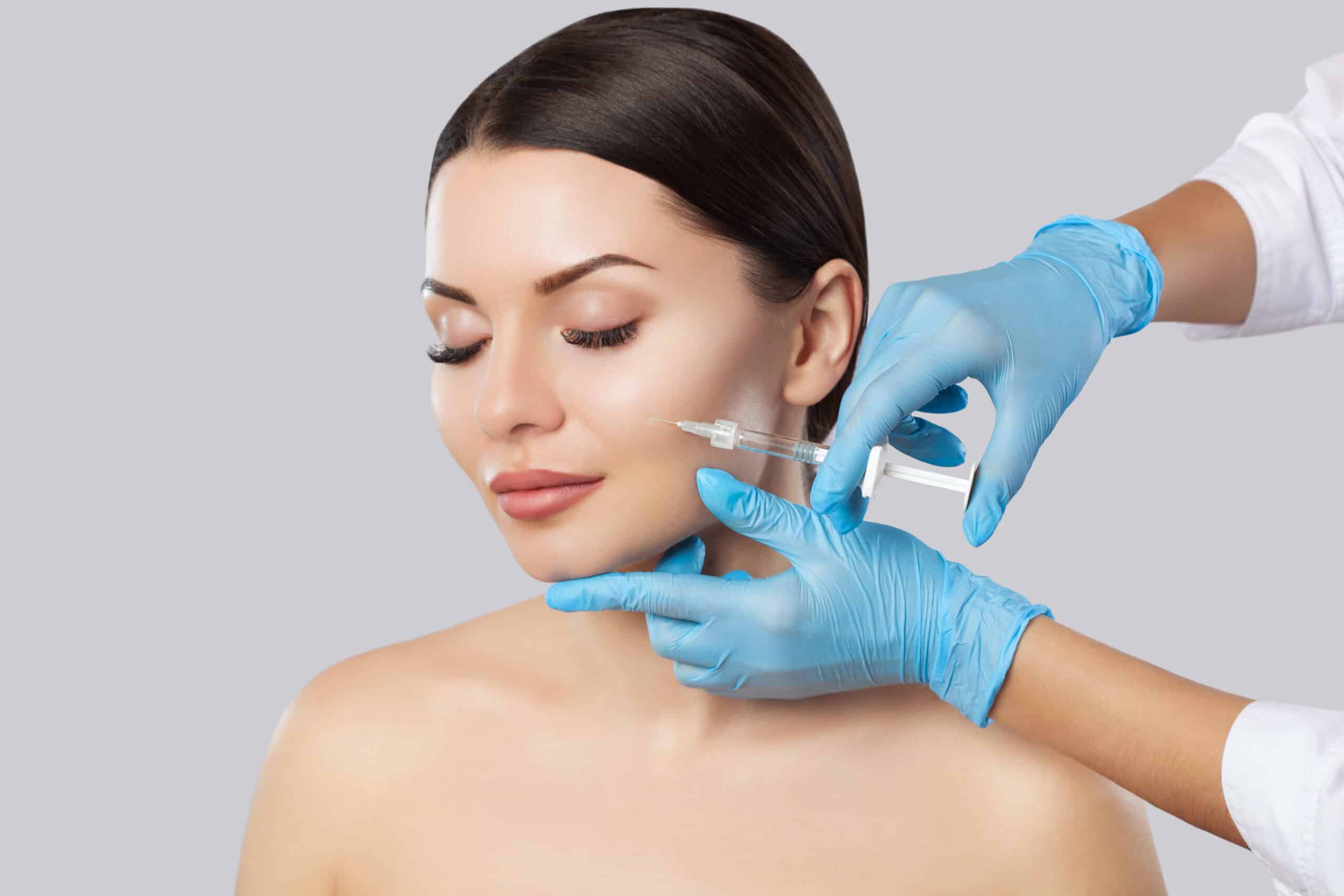 A woman getting a dermal filler injection